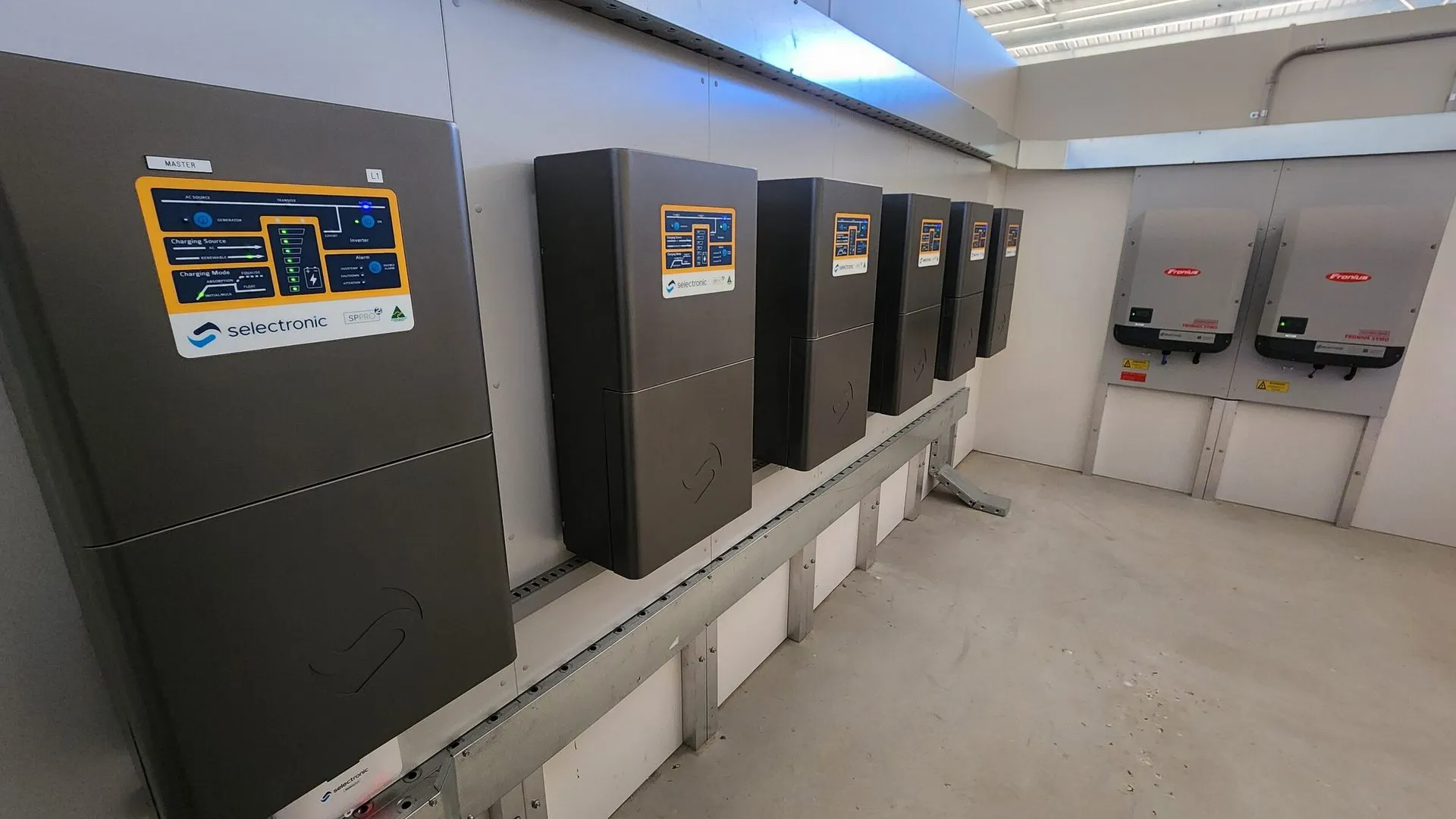 Selectronic inverters mounted along an off-grid plant room wall