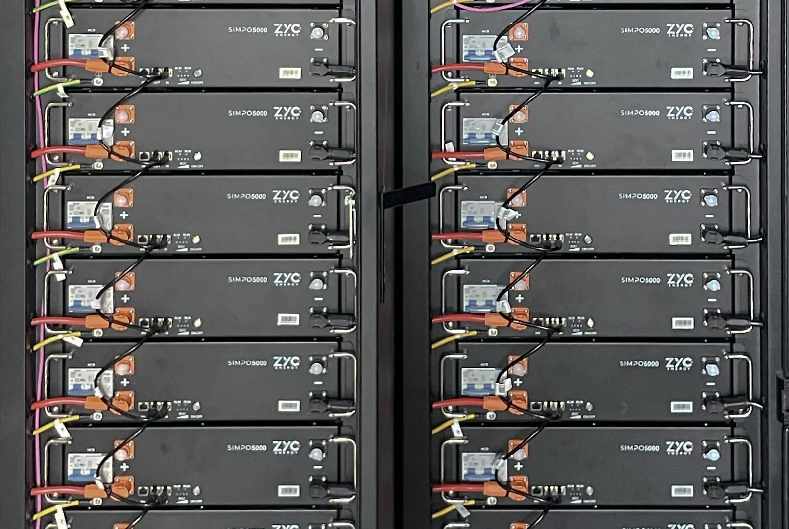 Stacked lithium battery modules in an off-grid battery cabinet