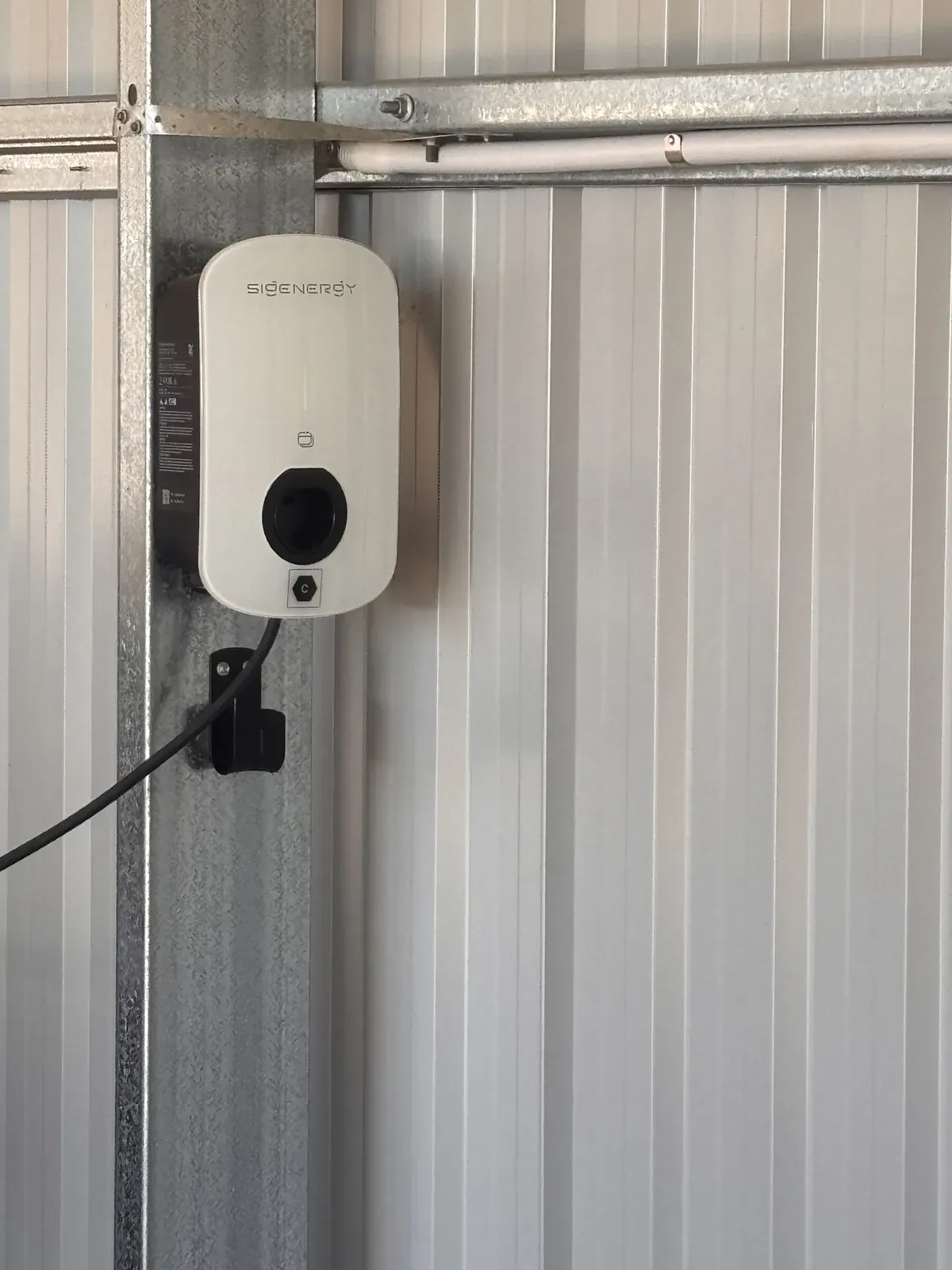 Wall-mounted EV charger in a shed