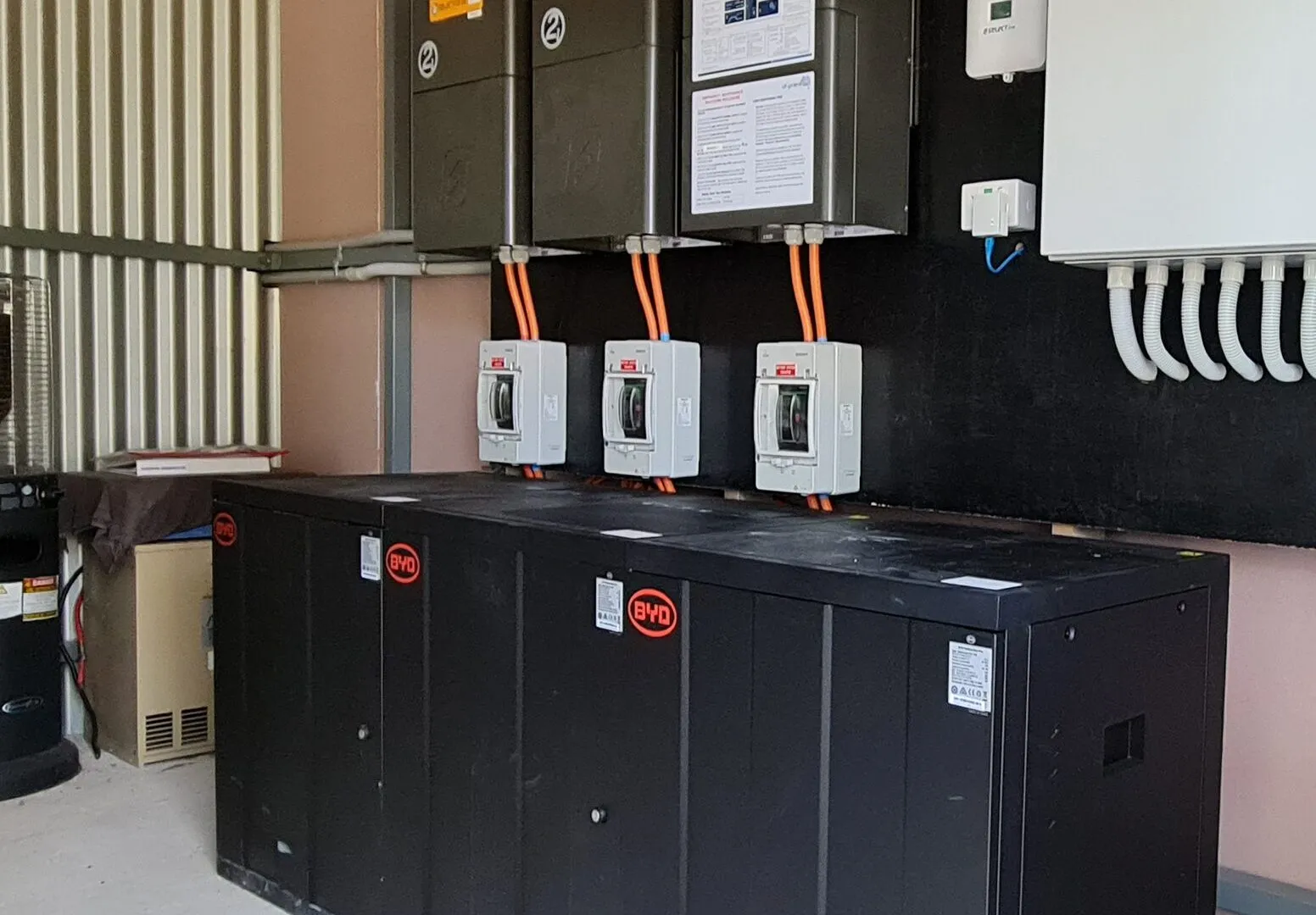 Inverters and battery cabinets installed in a plant room