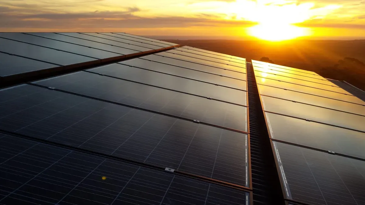 Solar panels on a roof at sunset