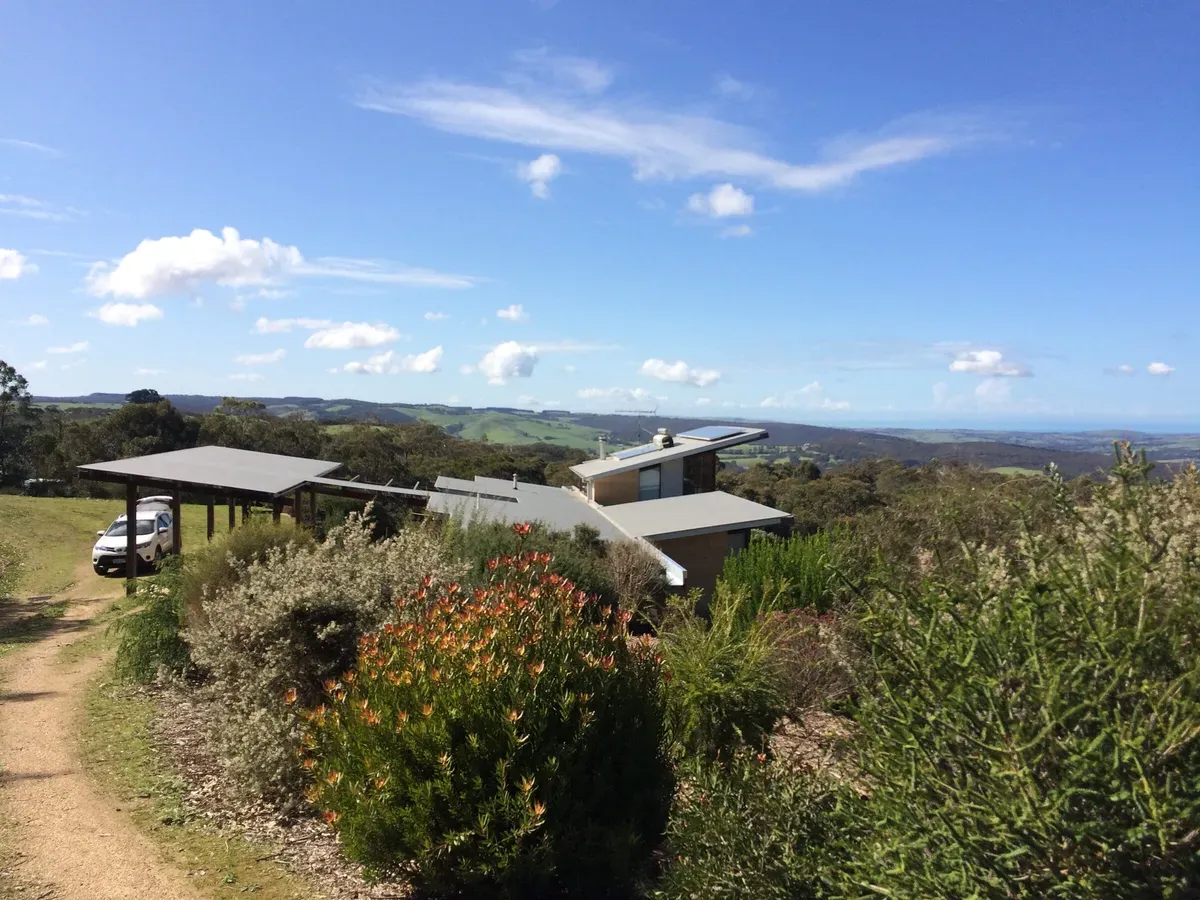 Off-grid home set among native plantings