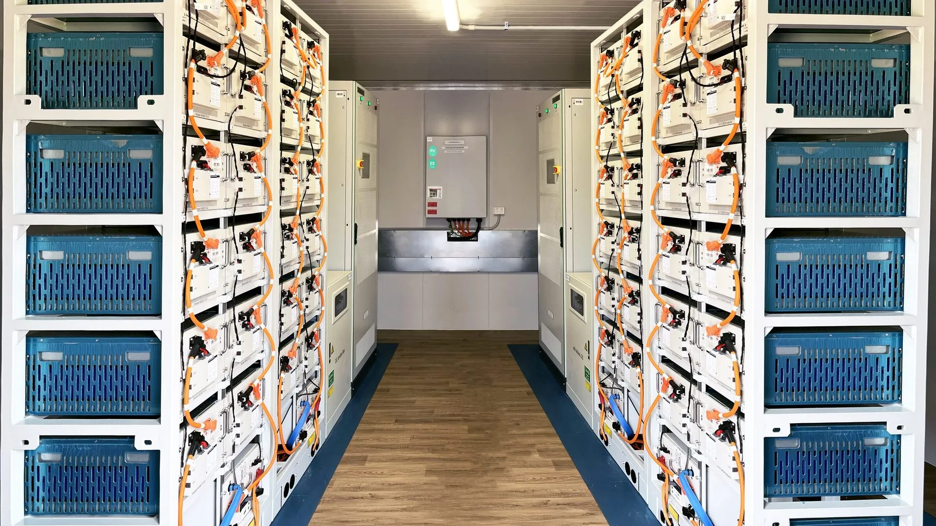 Rows of lithium battery racks inside an off-grid battery container