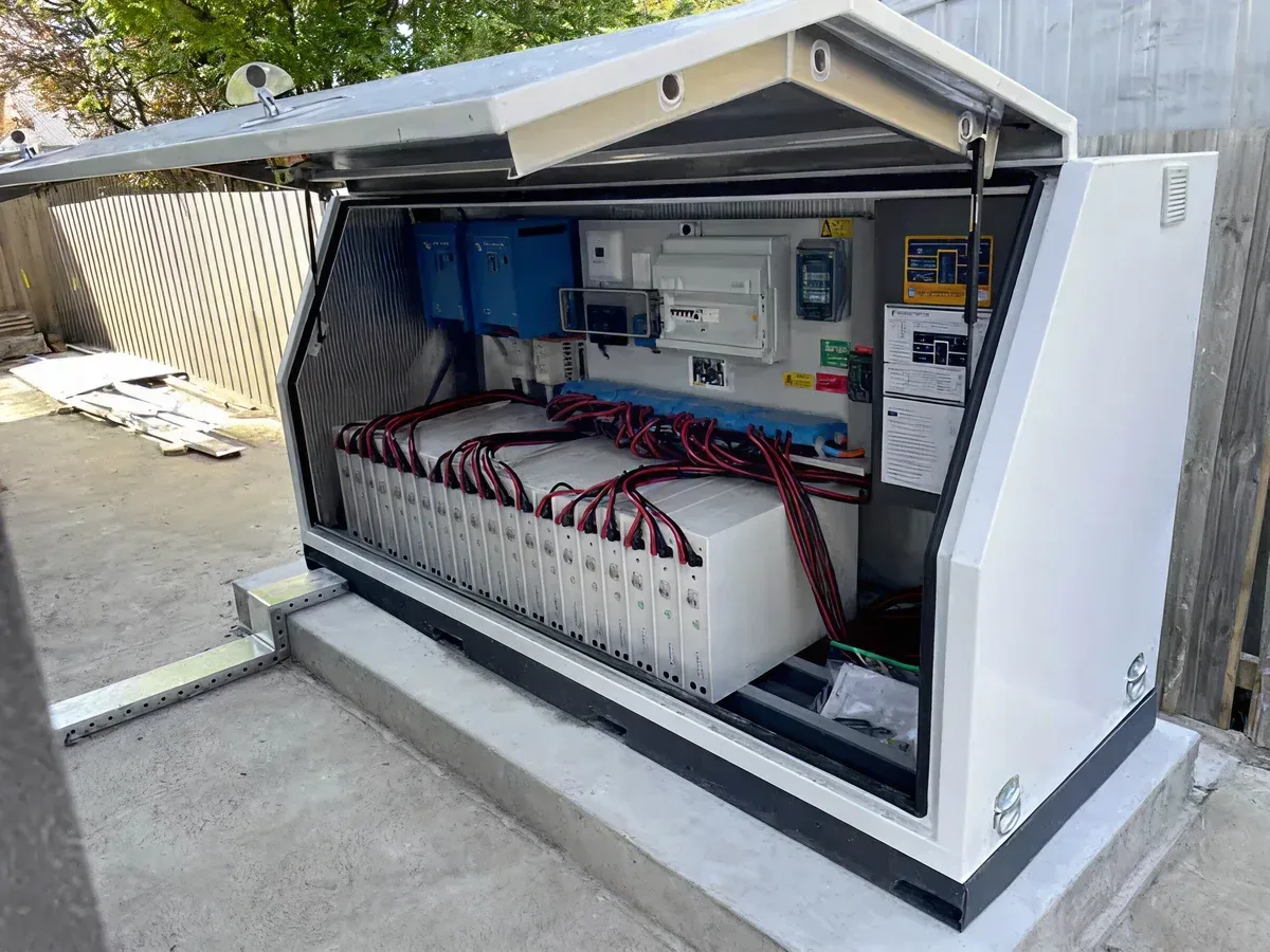 Open outdoor battery enclosure with wired lithium battery modules
