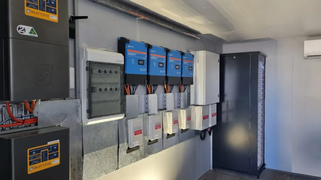 Wall-mounted Victron inverter and electrical cabinet installation