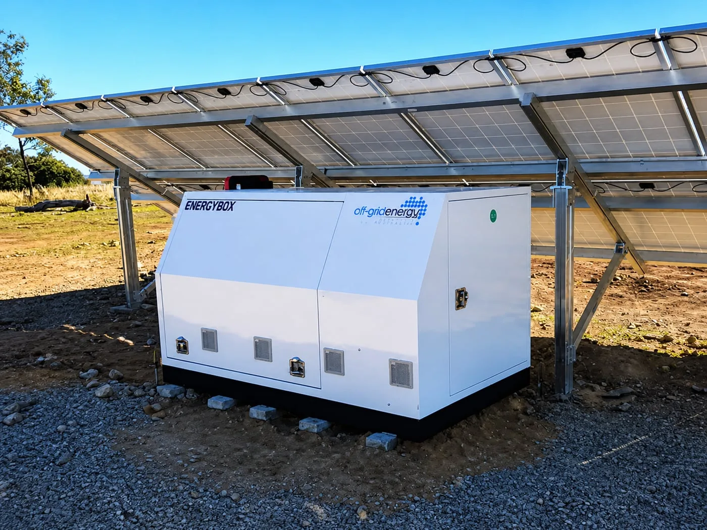 Energy Box under a ground-mounted solar array