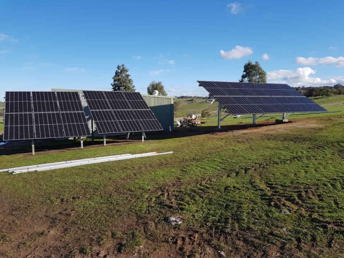 Multiple ground mounted solar panels for off-grid power system